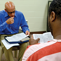 Ken studies the Bible with an inmate