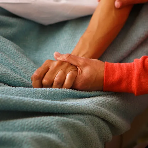 Holding hand in hospital