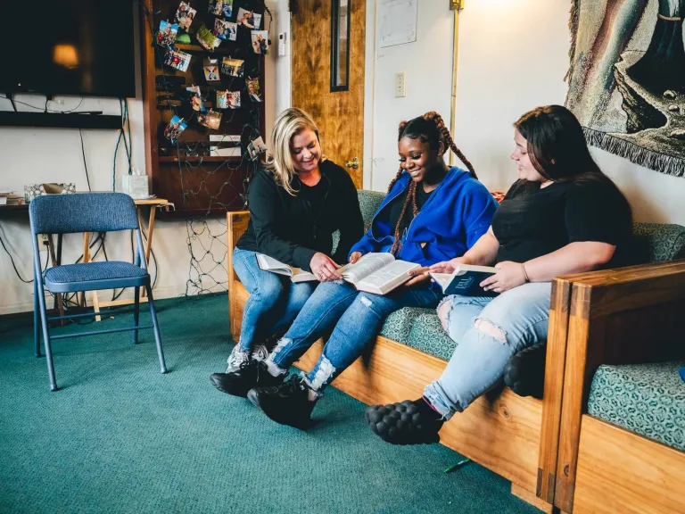 Emily reading bible to girls