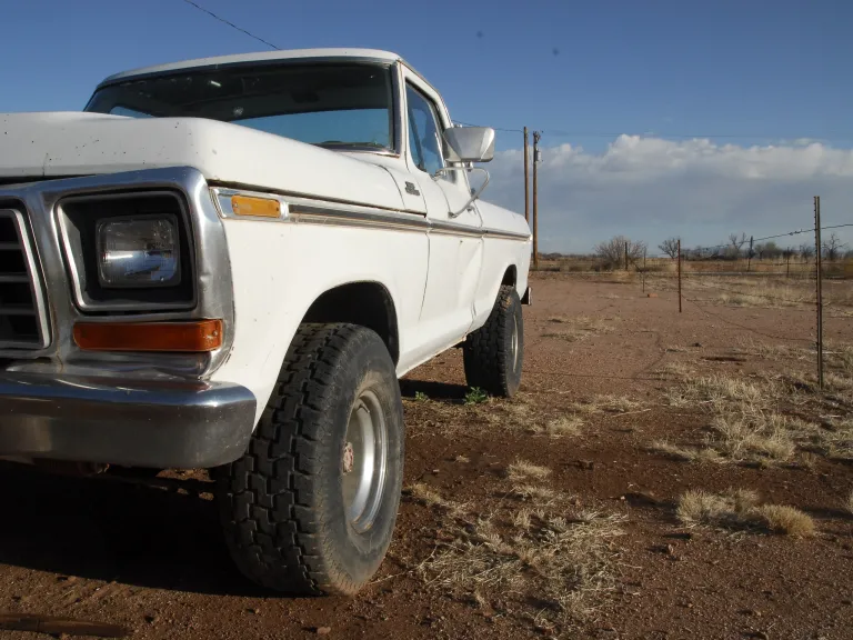 truck in a desert ready to be worked on by a missionary