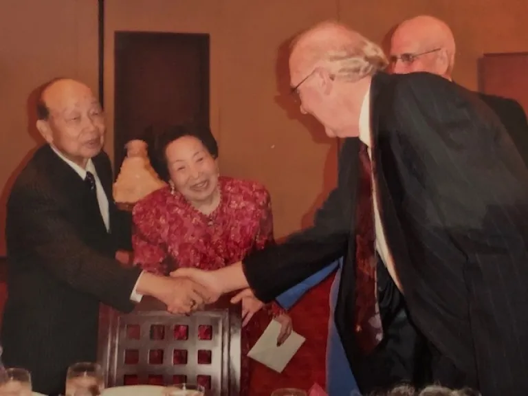 John Kim shaking hands