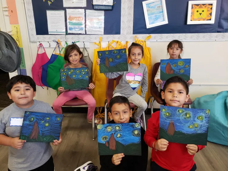 kids with stary night paintings