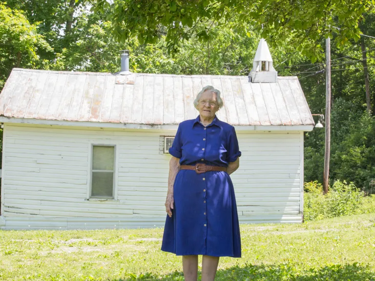 betty glover in front church