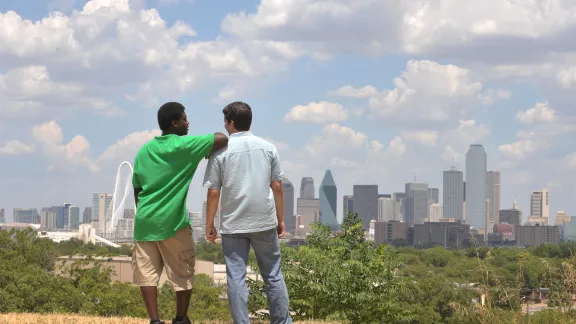 urban ministry men overlooking a large city