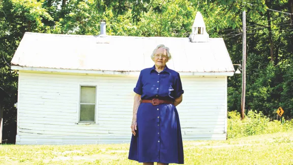 Betty Glover in front of Church