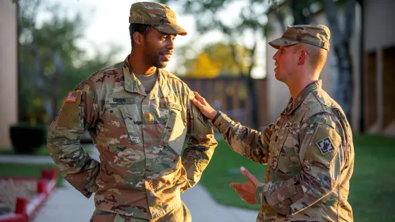 Dalsis with hand on a soldier
