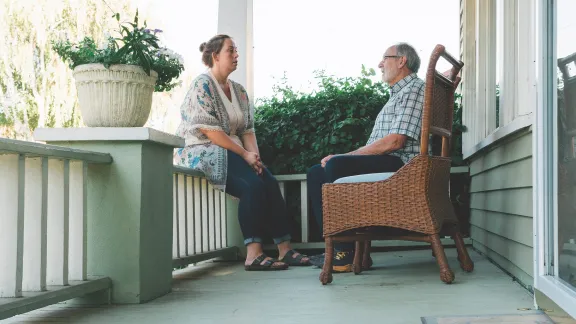 Gary talking to woman