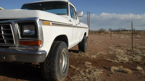 truck in a desert ready to be worked on by a missionary