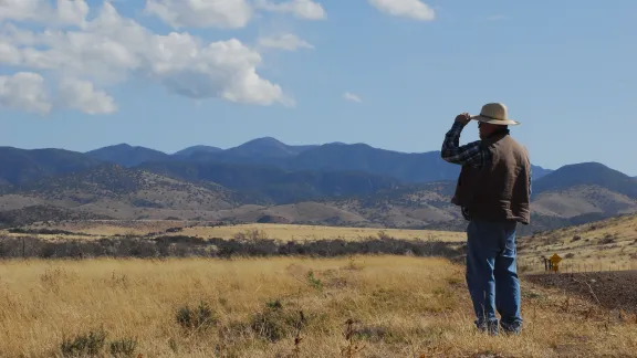 Randy looking out in a rural area