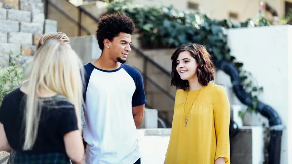 college campus talking to students