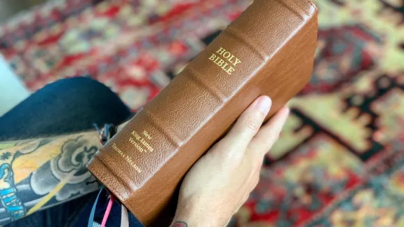 holding the bible