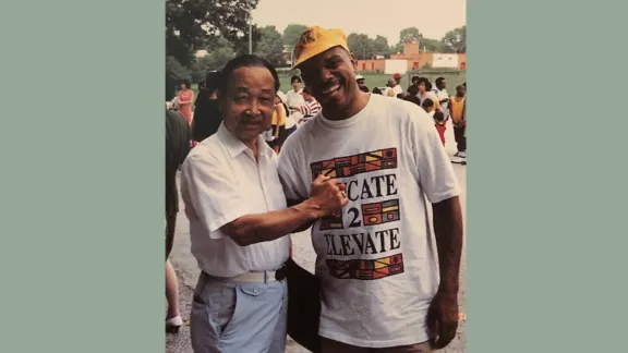 John Kim with someone in the field