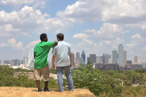 urban ministry men overlooking a large city