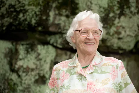 senior woman smiling outdoors