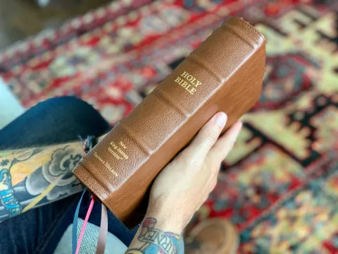 holding the bible